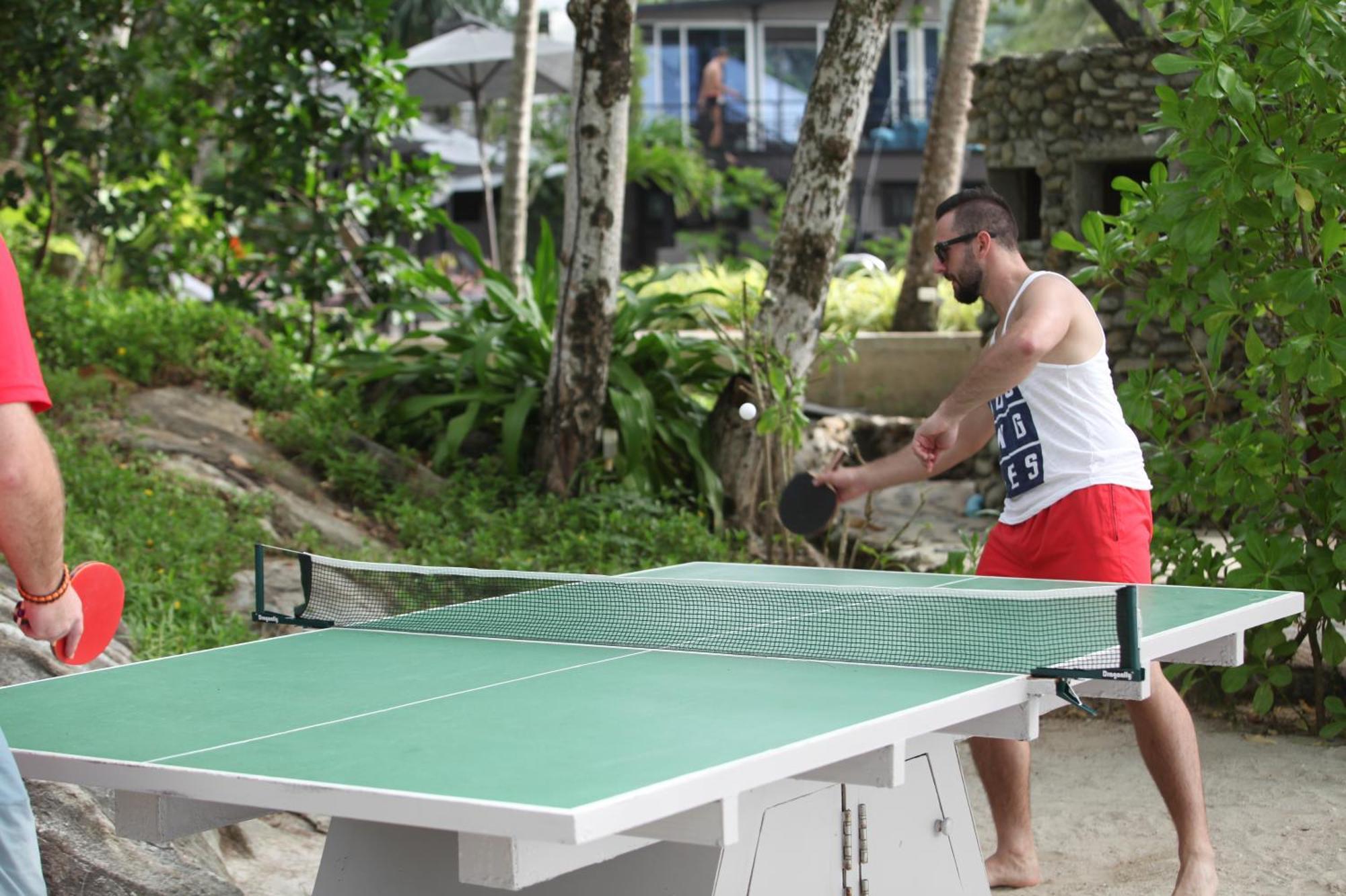 Moracea By Khao Lak Resort Dış mekan fotoğraf A table tennis player